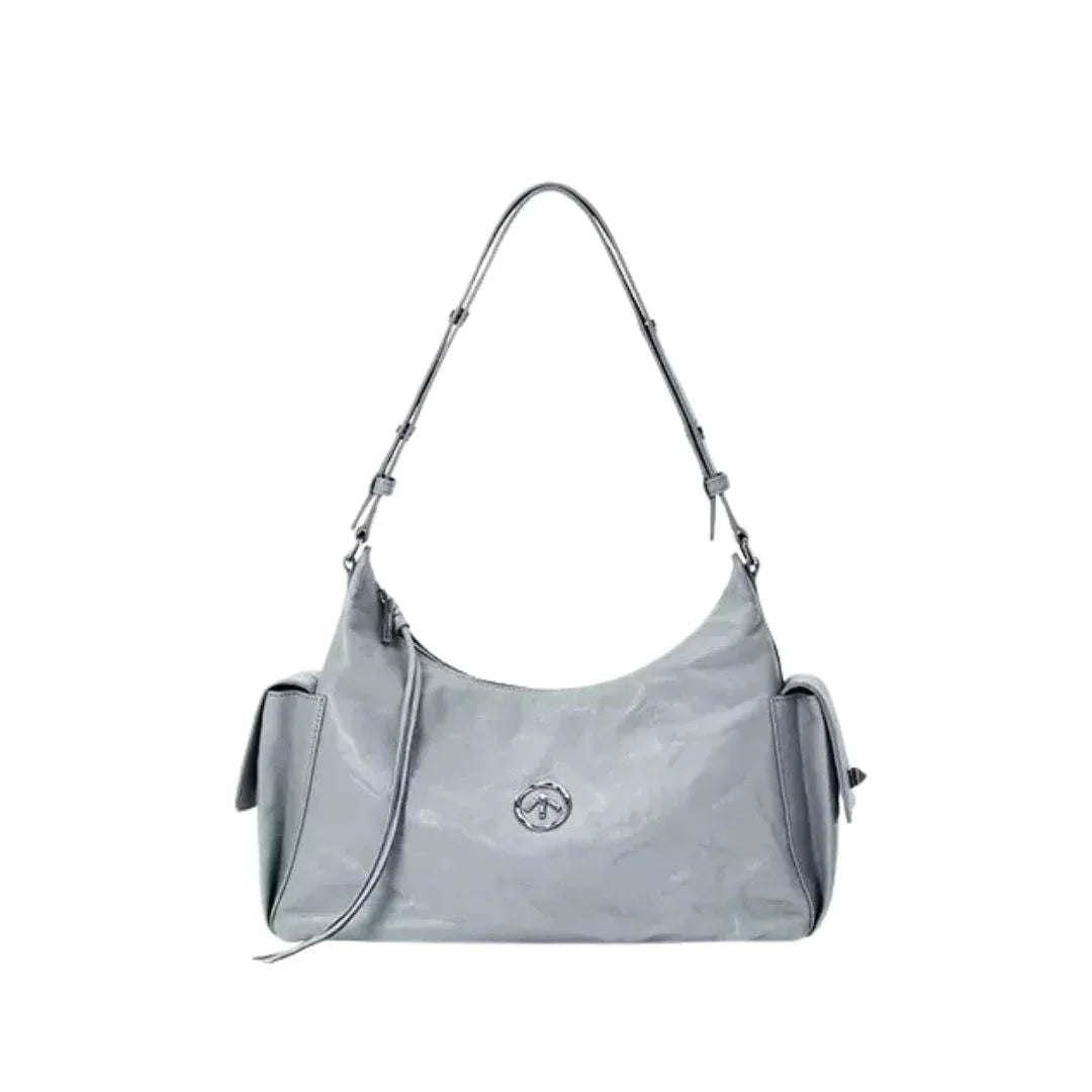 Light gray shoulder bag with logo, side pockets, and adjustable strap on white background