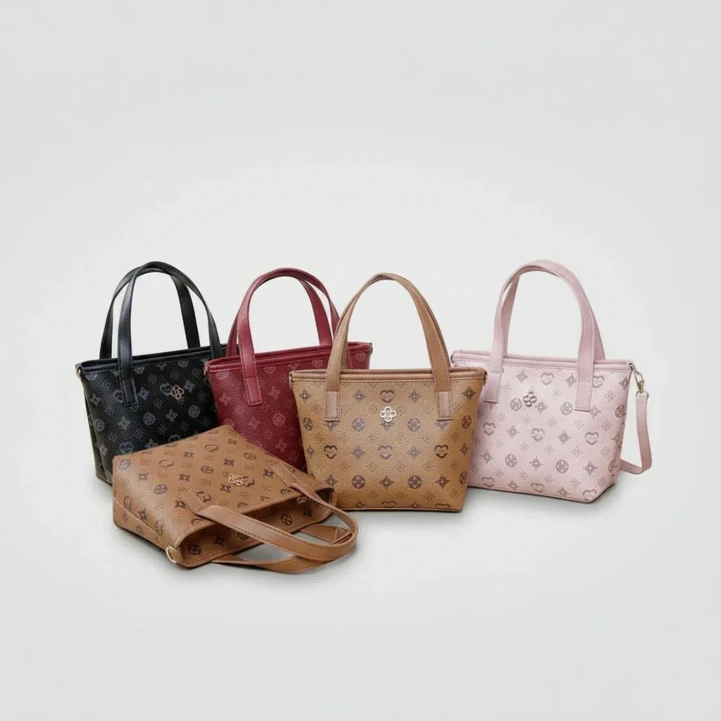 Assorted small tote handbags in black, red, brown, and pink with monogram patterns on white background