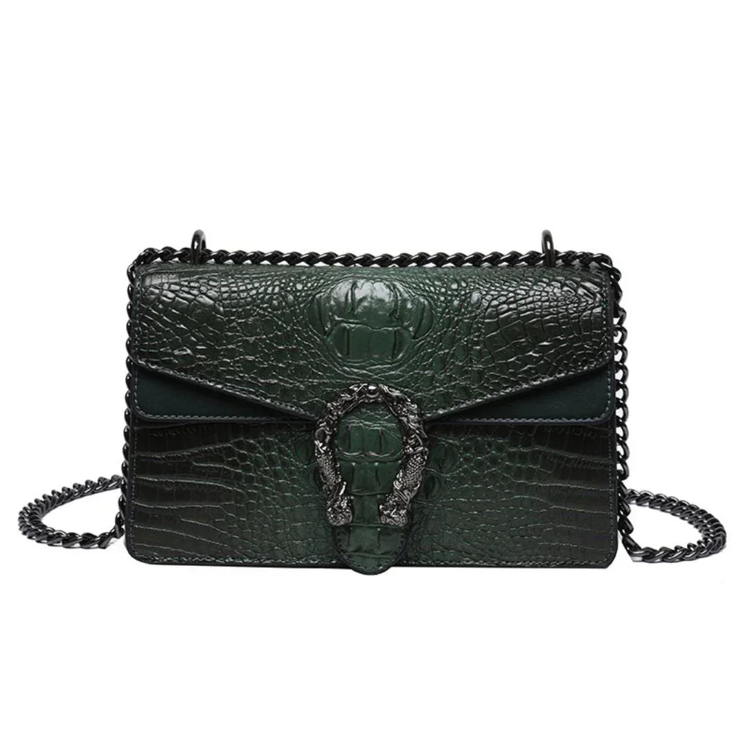 Dark green crocodile embossed leather shoulder bag with chain strap and ornate buckle detail