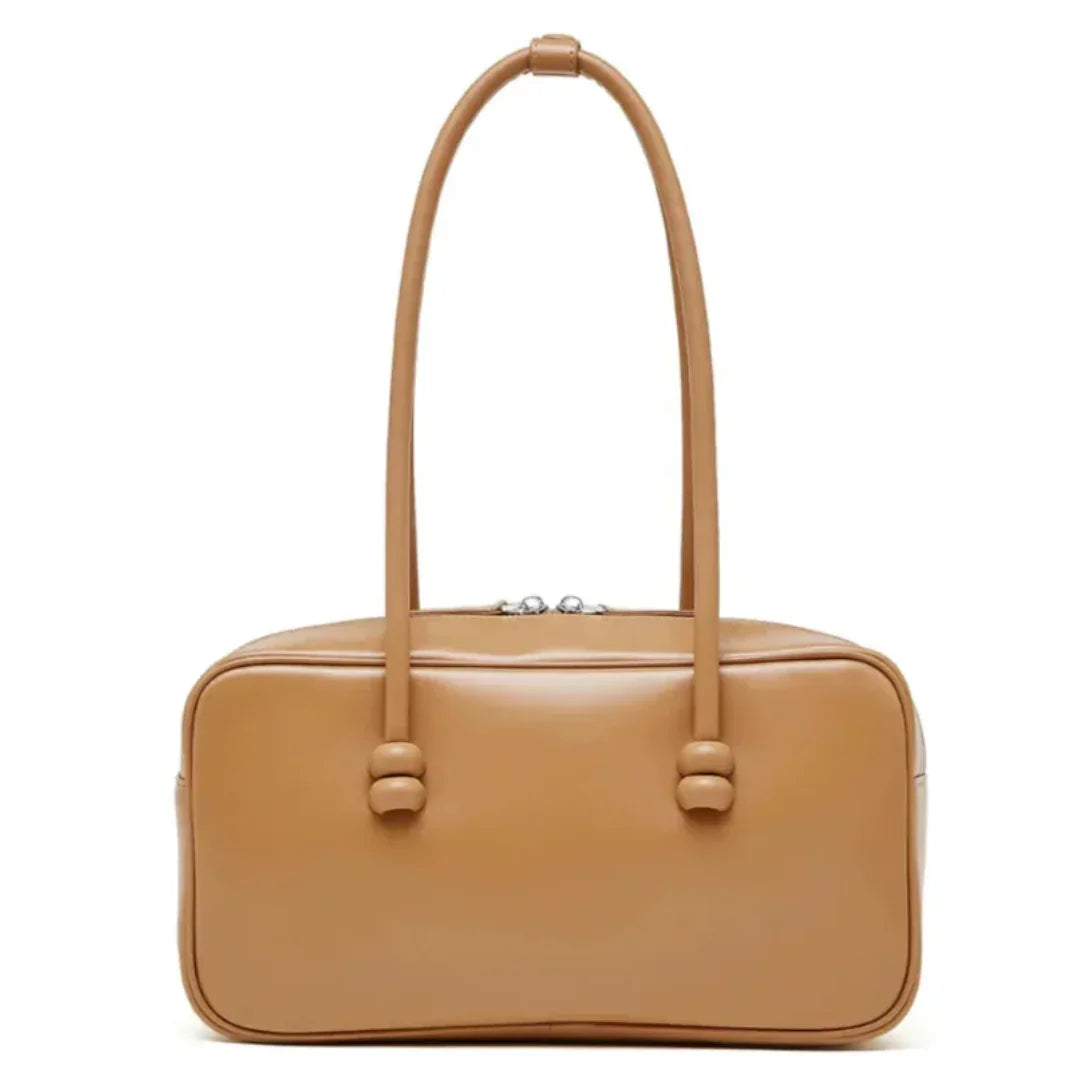 Tan rectangular leather handbag with double top handles on a white background