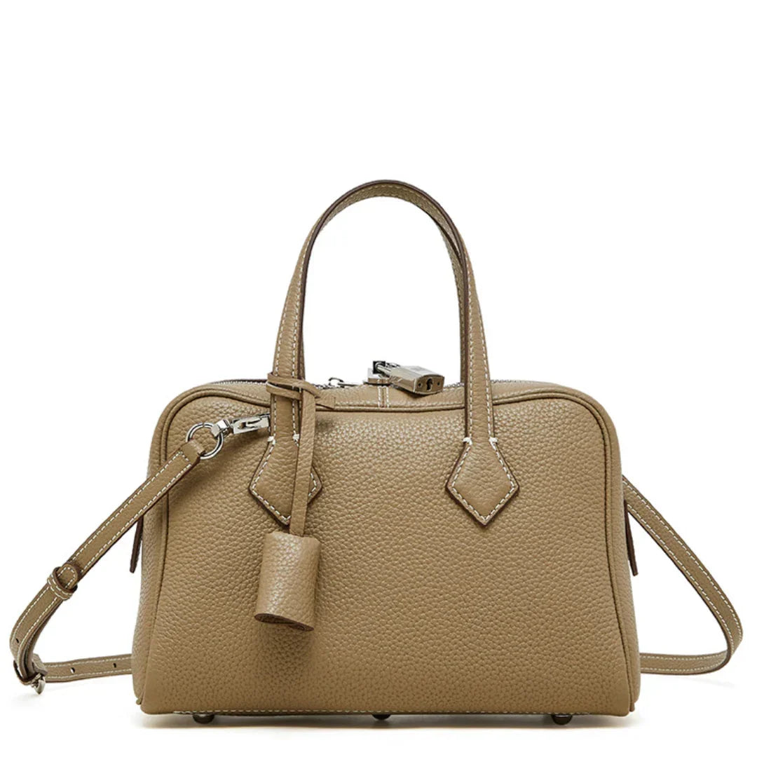 Taupe leather satchel handbag with top handles, detachable strap, and silver hardware