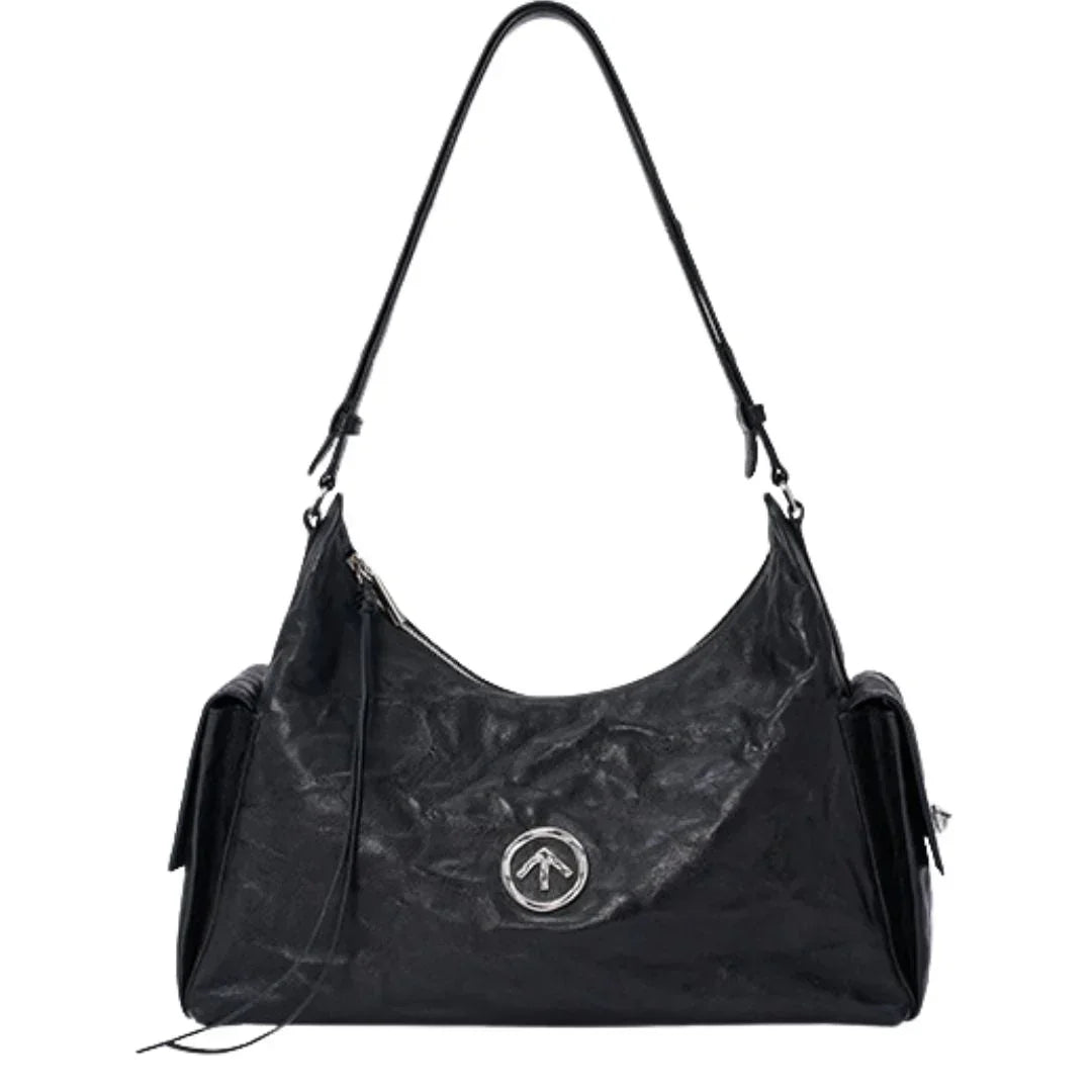 Black leather shoulder bag with silver round logo, front zipper, and side pockets