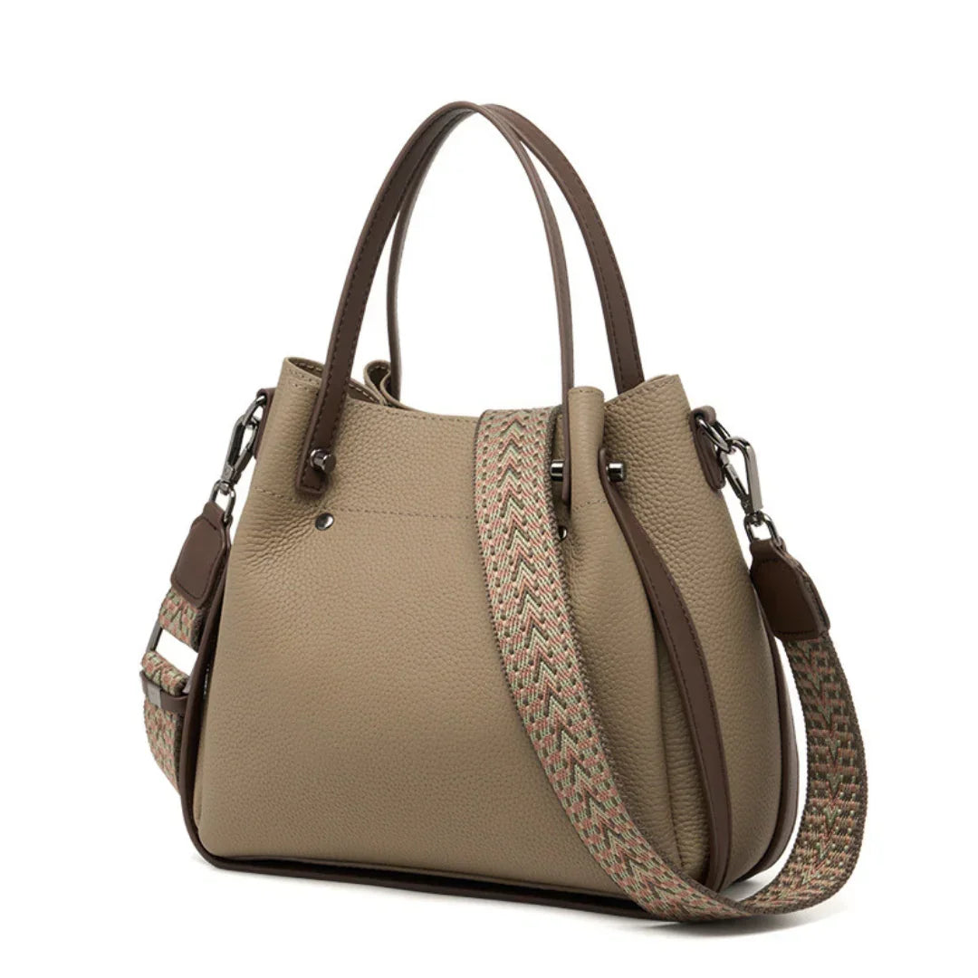 Taupe leather handbag with double handles and patterned adjustable shoulder strap