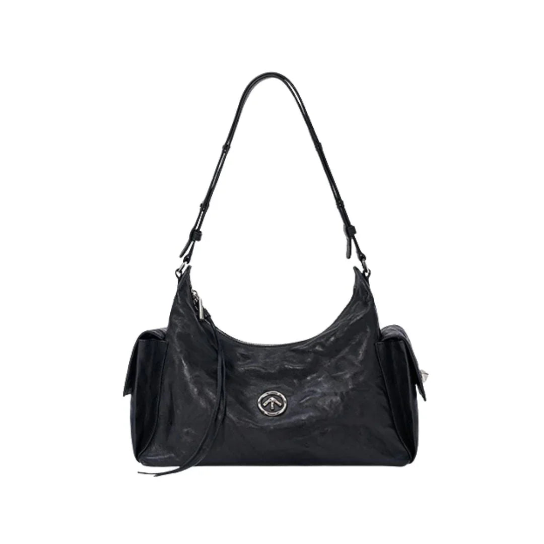 Black leather shoulder bag with side pockets and silver logo on white background