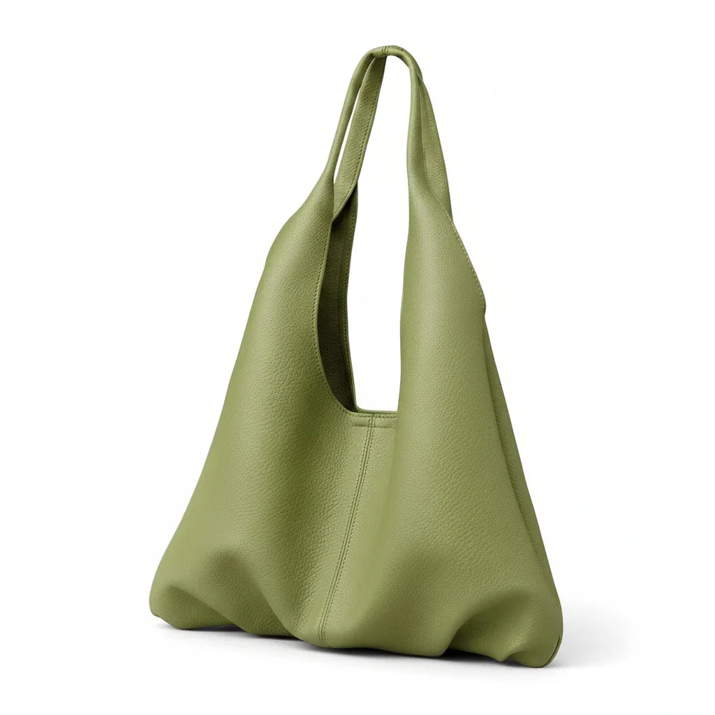 Sage green leather tote bag with modern minimalist design on white background