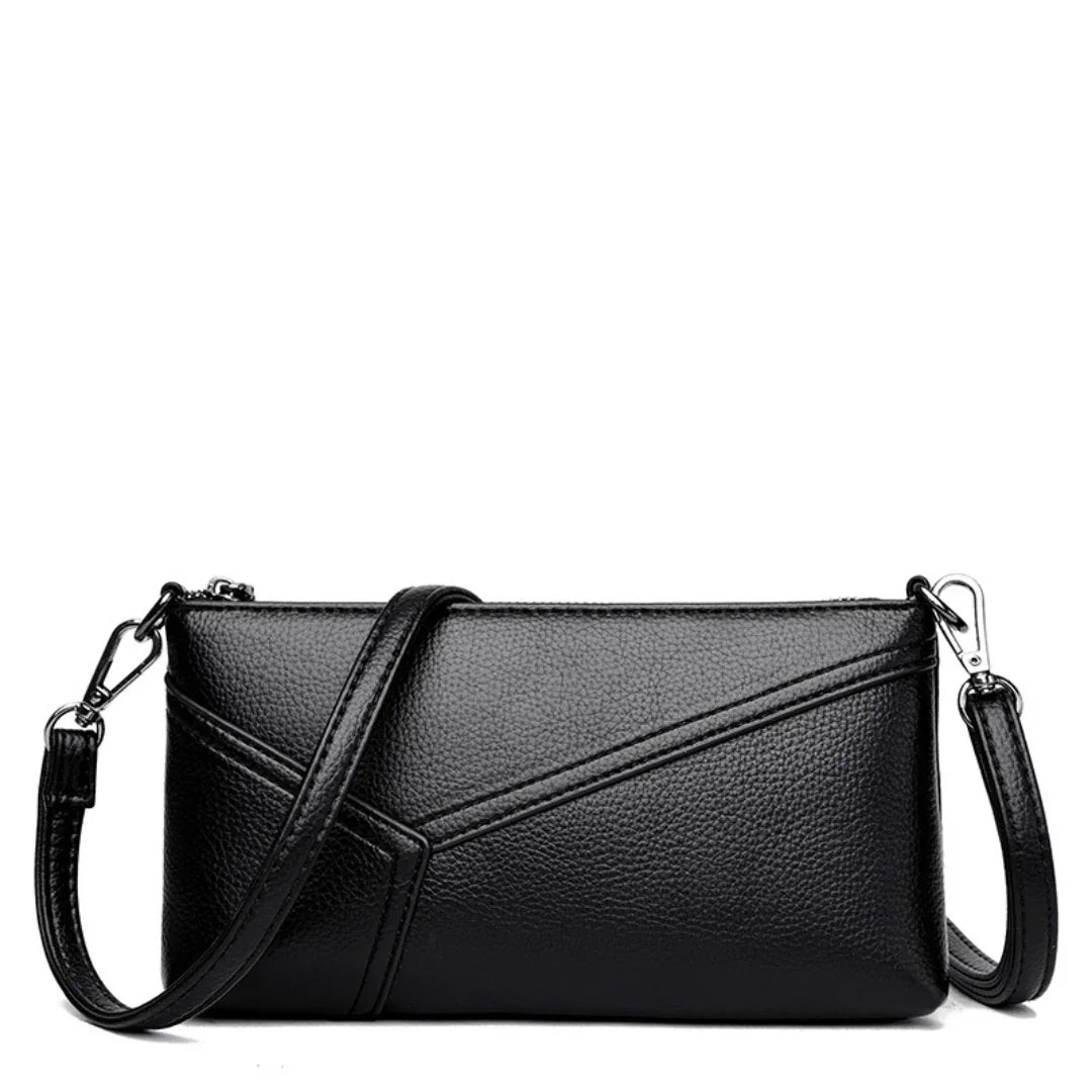 Black leather crossbody bag with detachable strap and geometric stitching details