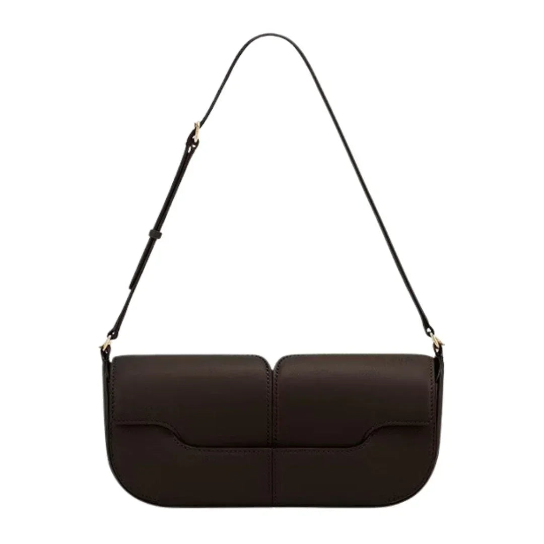 Minimalist dark brown leather shoulder bag with adjustable strap on white background
