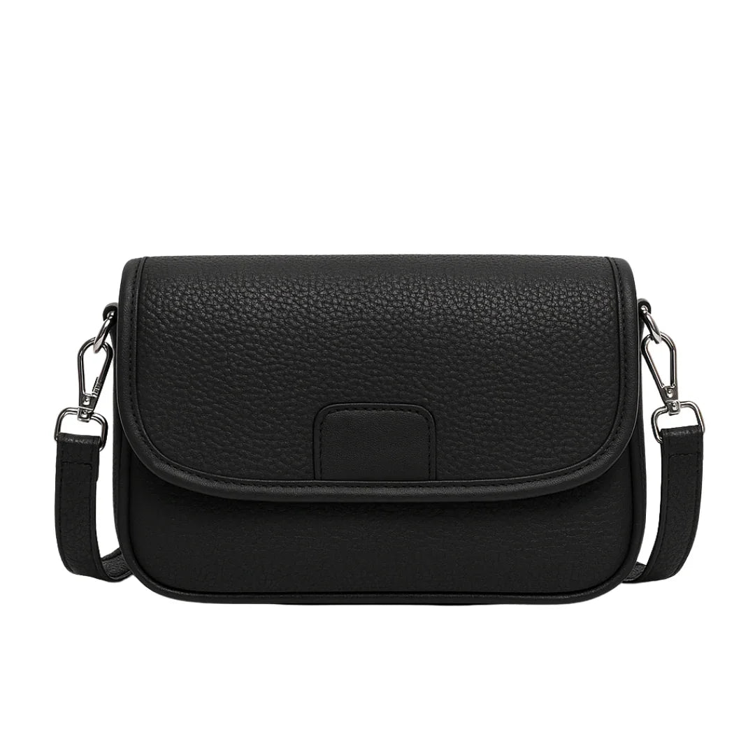 Black textured leather crossbody bag with flap closure and silver hardware on white background