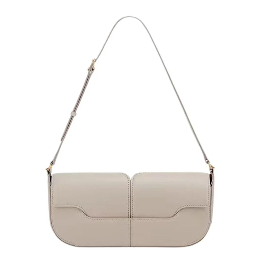 Beige rectangular leather shoulder bag with adjustable strap on white background