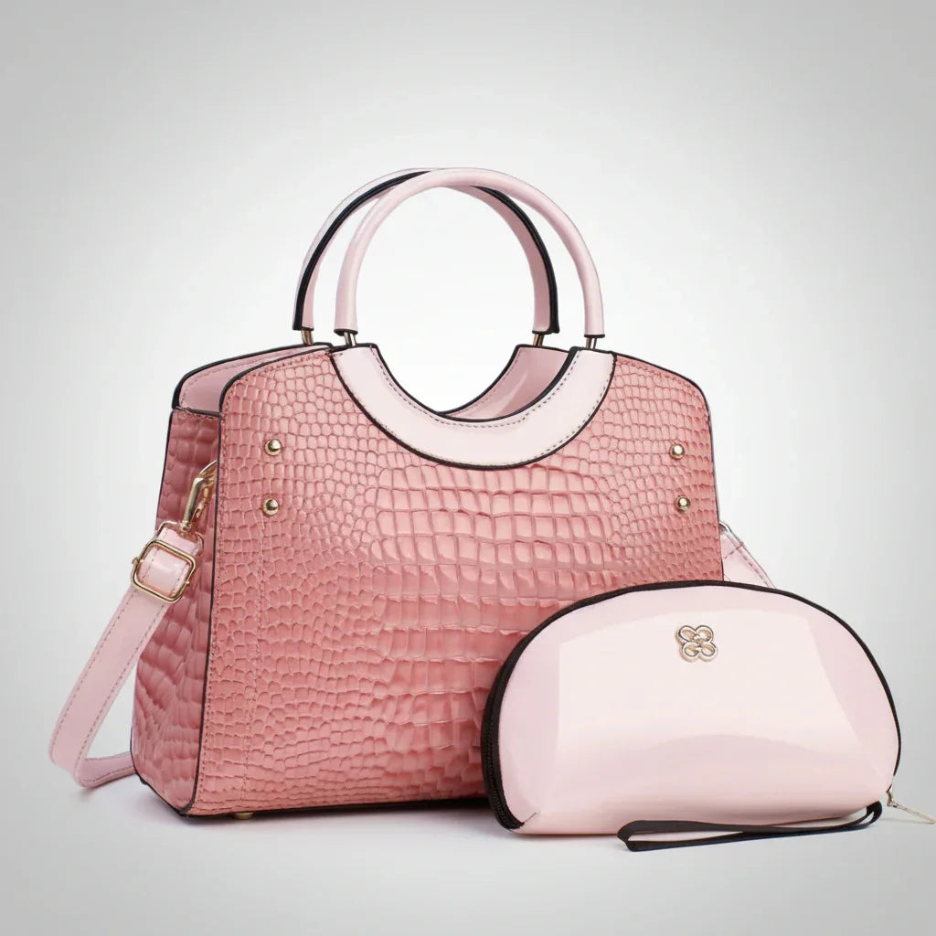 Pink crocodile pattern handbag with matching glossy cosmetic bag