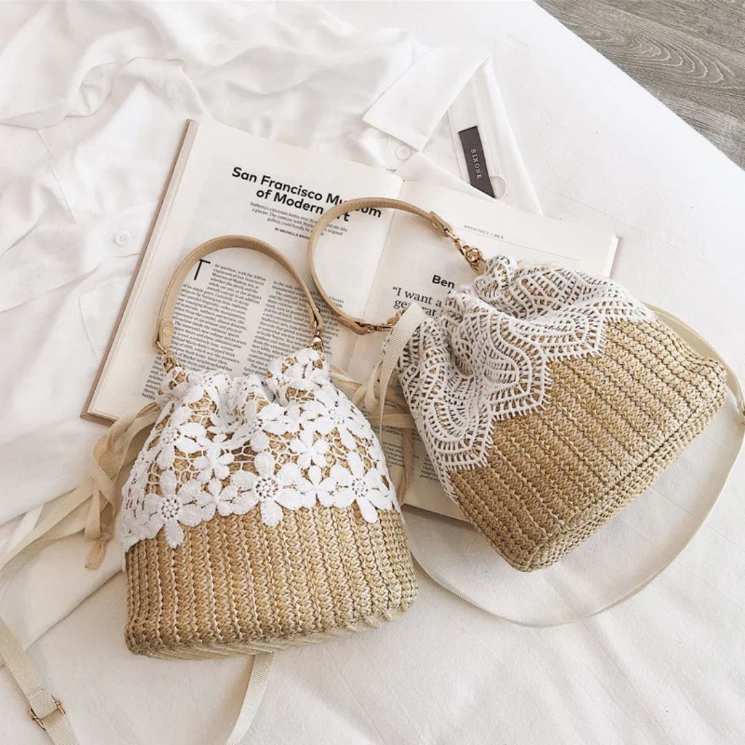 Two straw lace handbags on white shirt with open magazines, flat lay style
