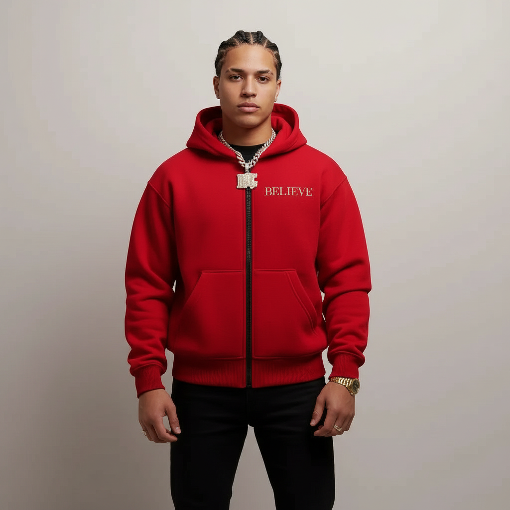 Red hoodie with 'BELIEVE' text on a gray background