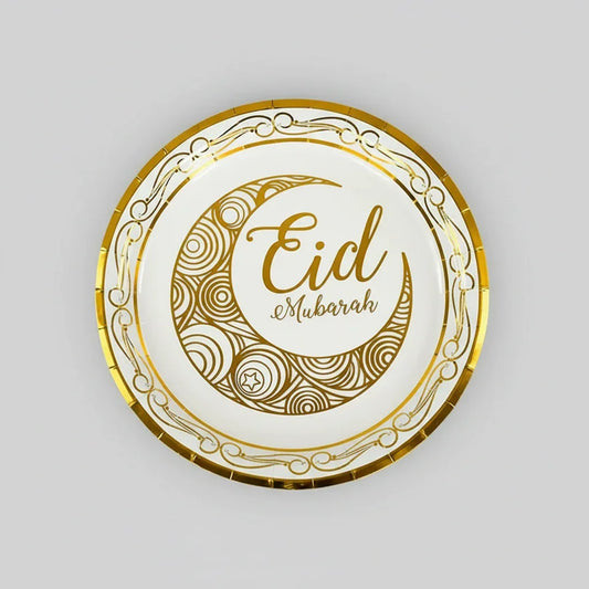 Decorative plate with 'Eid Mubarak' text on a marble surface