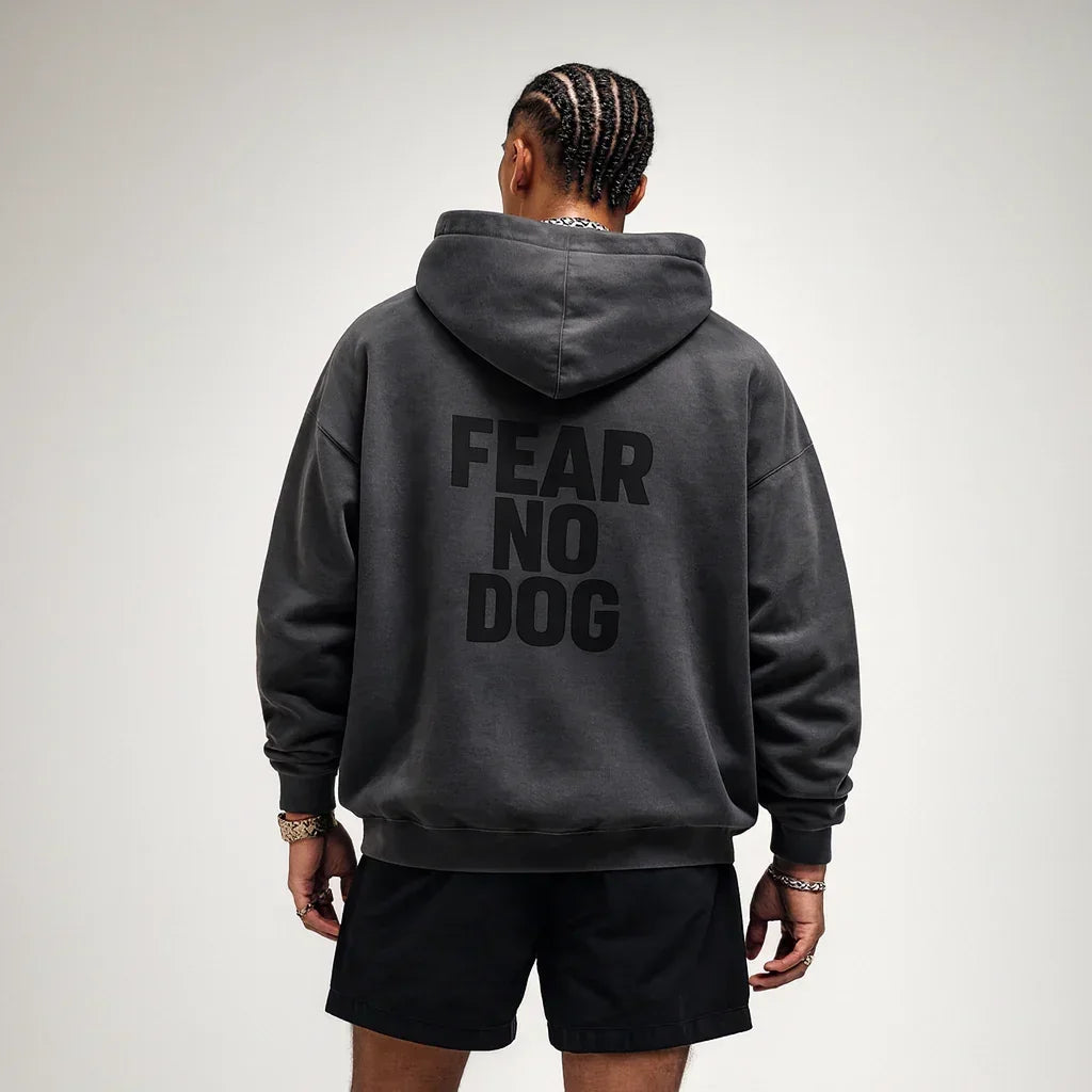 Man wearing a black hoodie Fear No Dog FND Hoodie Black