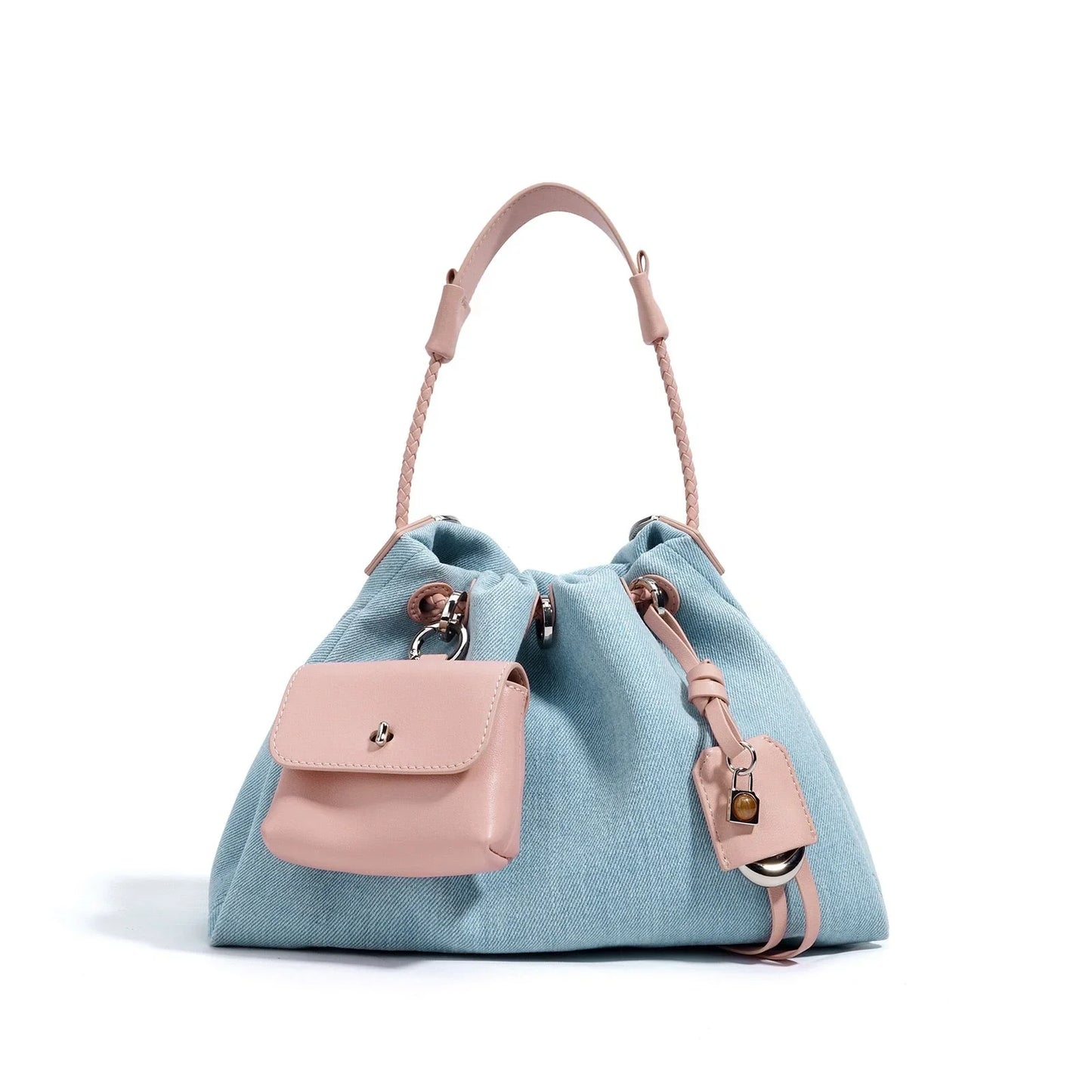 Light blue denim bucket bag with pink leather handle and attached pink pouch