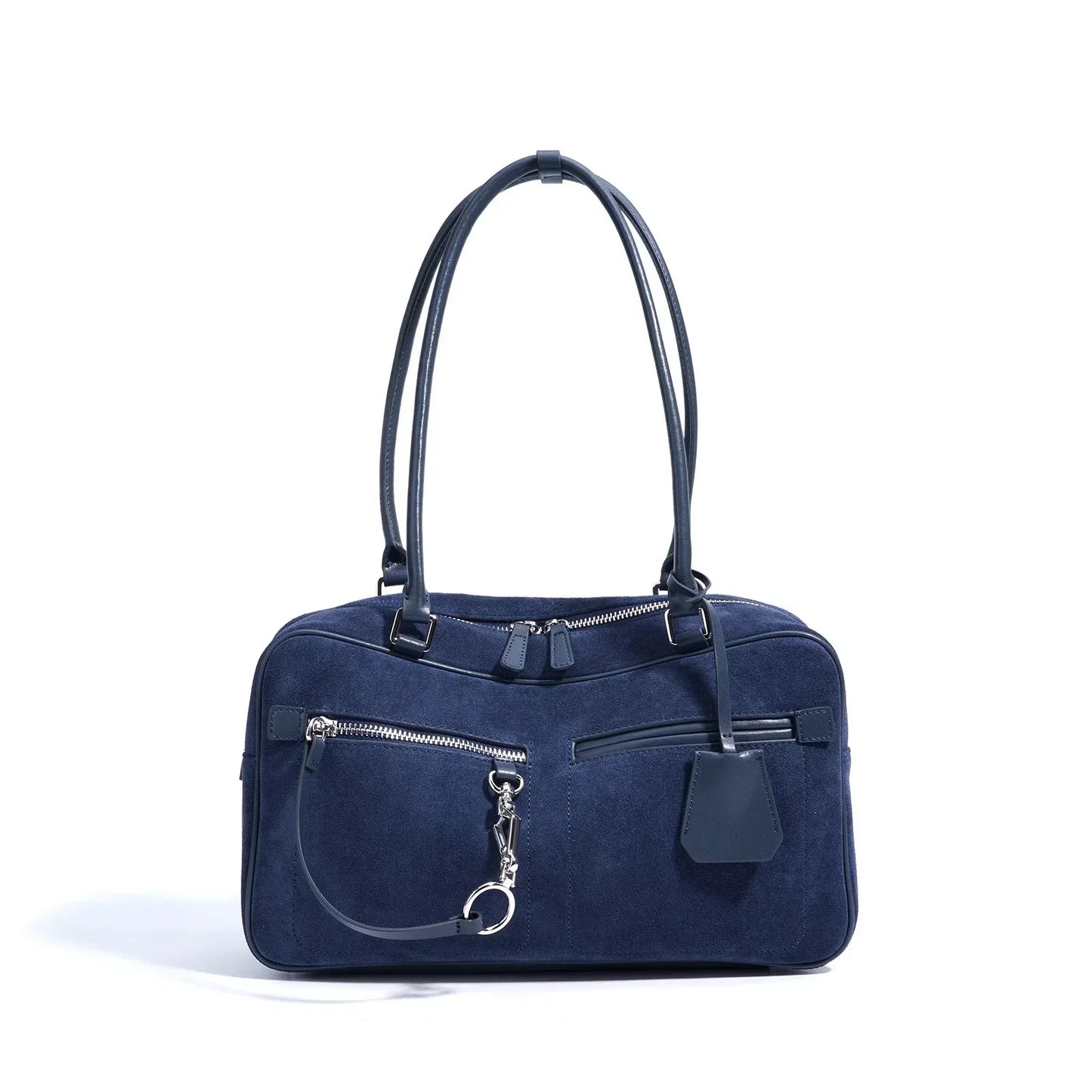 Navy blue suede shoulder bag with silver zippers and dual top handles on white background