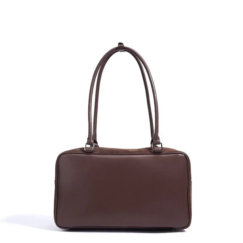 Brown leather rectangular shoulder bag with double straps on white background