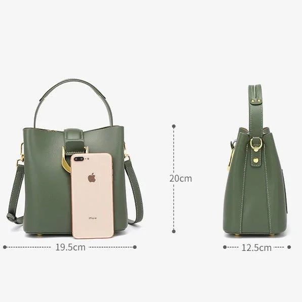 Olive green leather handbag with iPhone for scale, 20x19.5x12.5cm dimensions, gold hardware