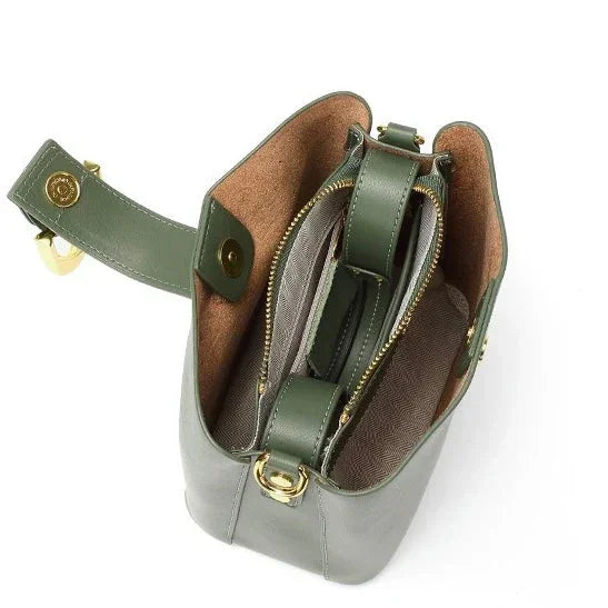 Open green leather shoulder bag with gold hardware and multiple inner compartments