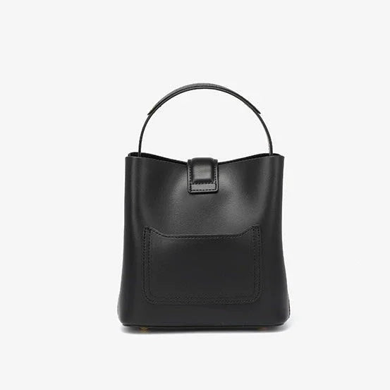 Black leather bucket bag with top handle and front pocket on white background