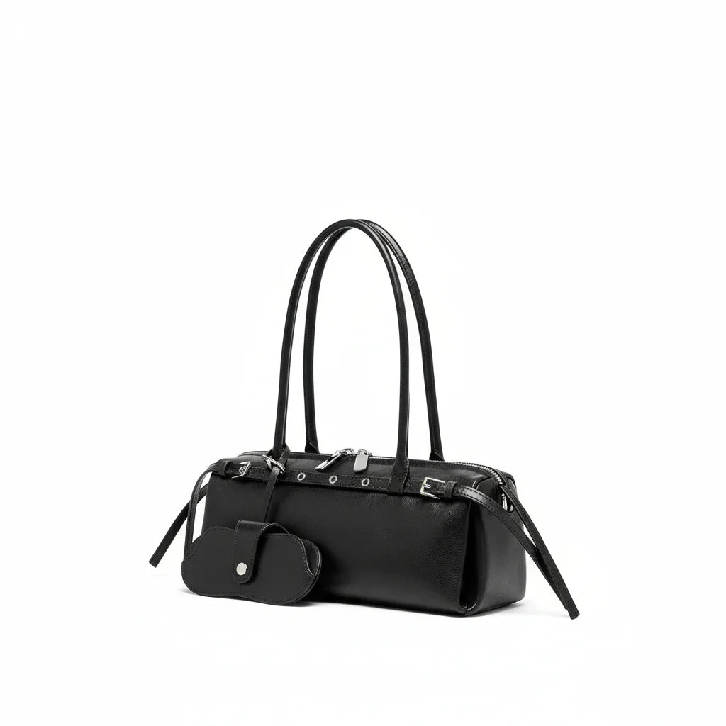 Black leather barrel shoulder bag with double handles and matching key pouch, white background