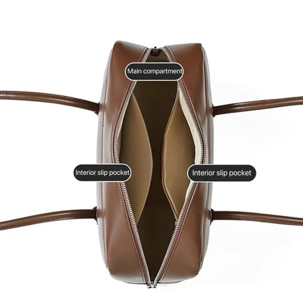 Brown leather handbag with open top view showing main compartment and two interior slip pockets