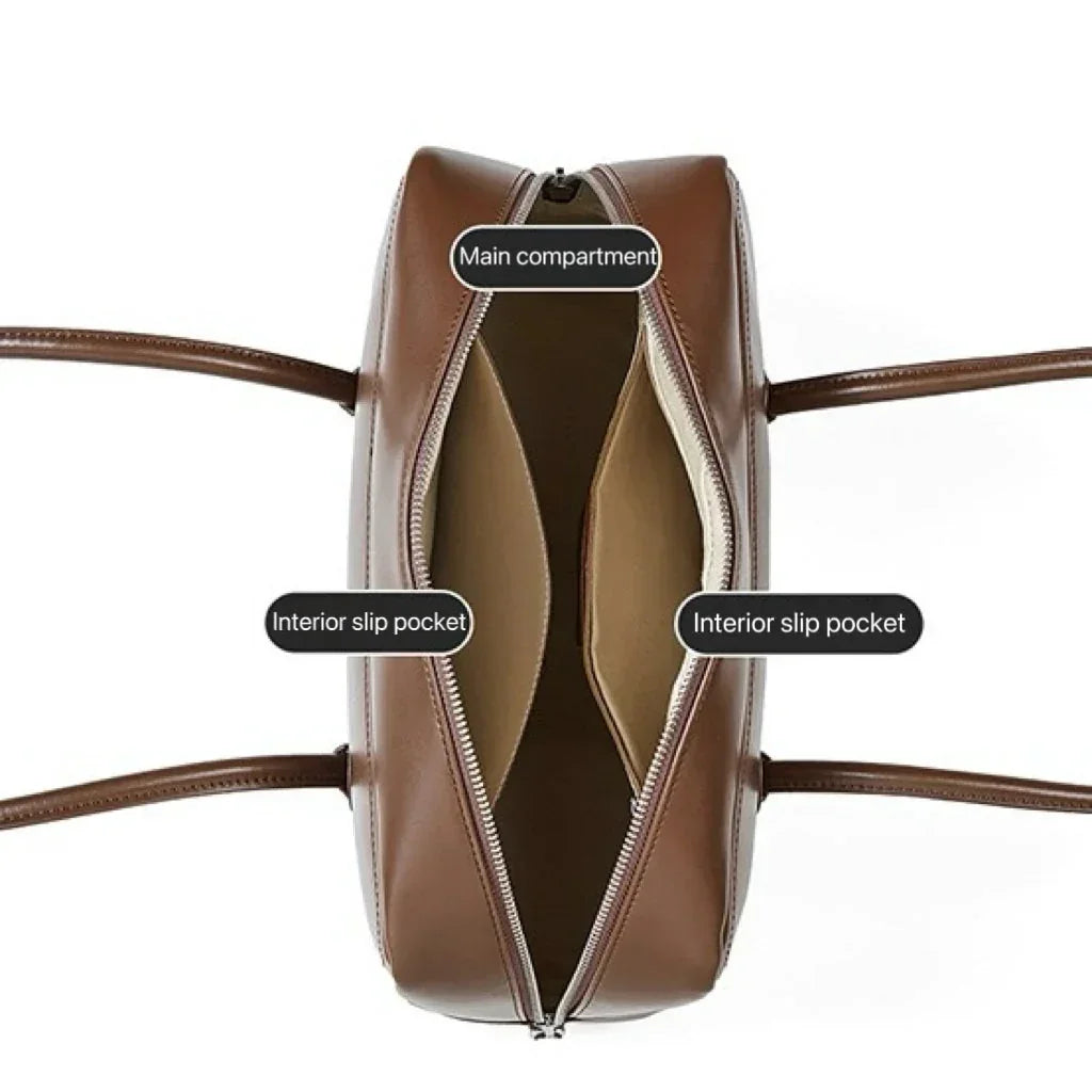 Brown leather handbag with open top view showing main compartment and two interior slip pockets