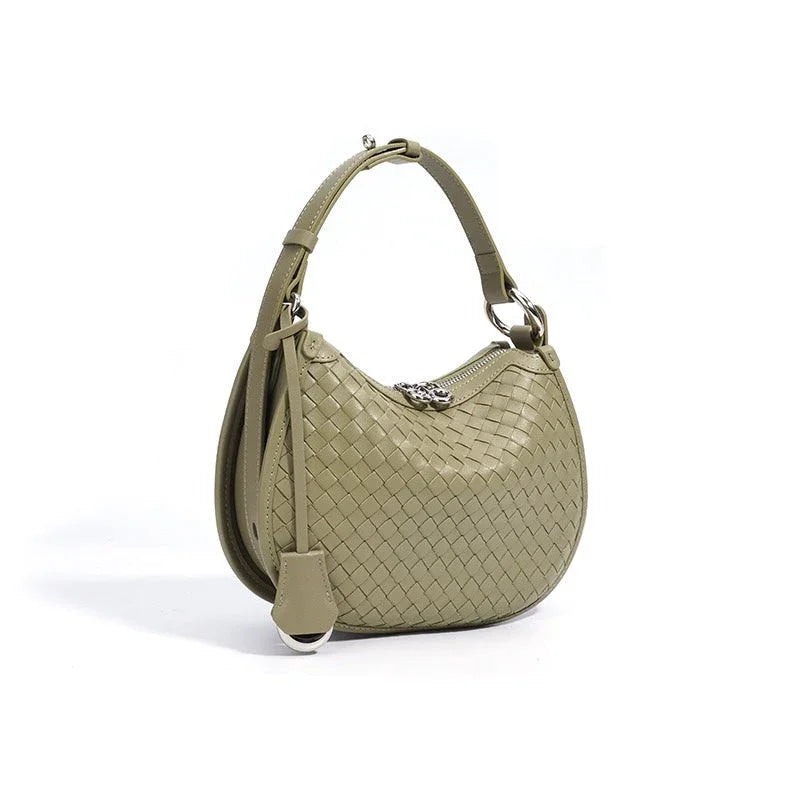 Woven olive green leather hobo bag with short strap and silver zipper on white background