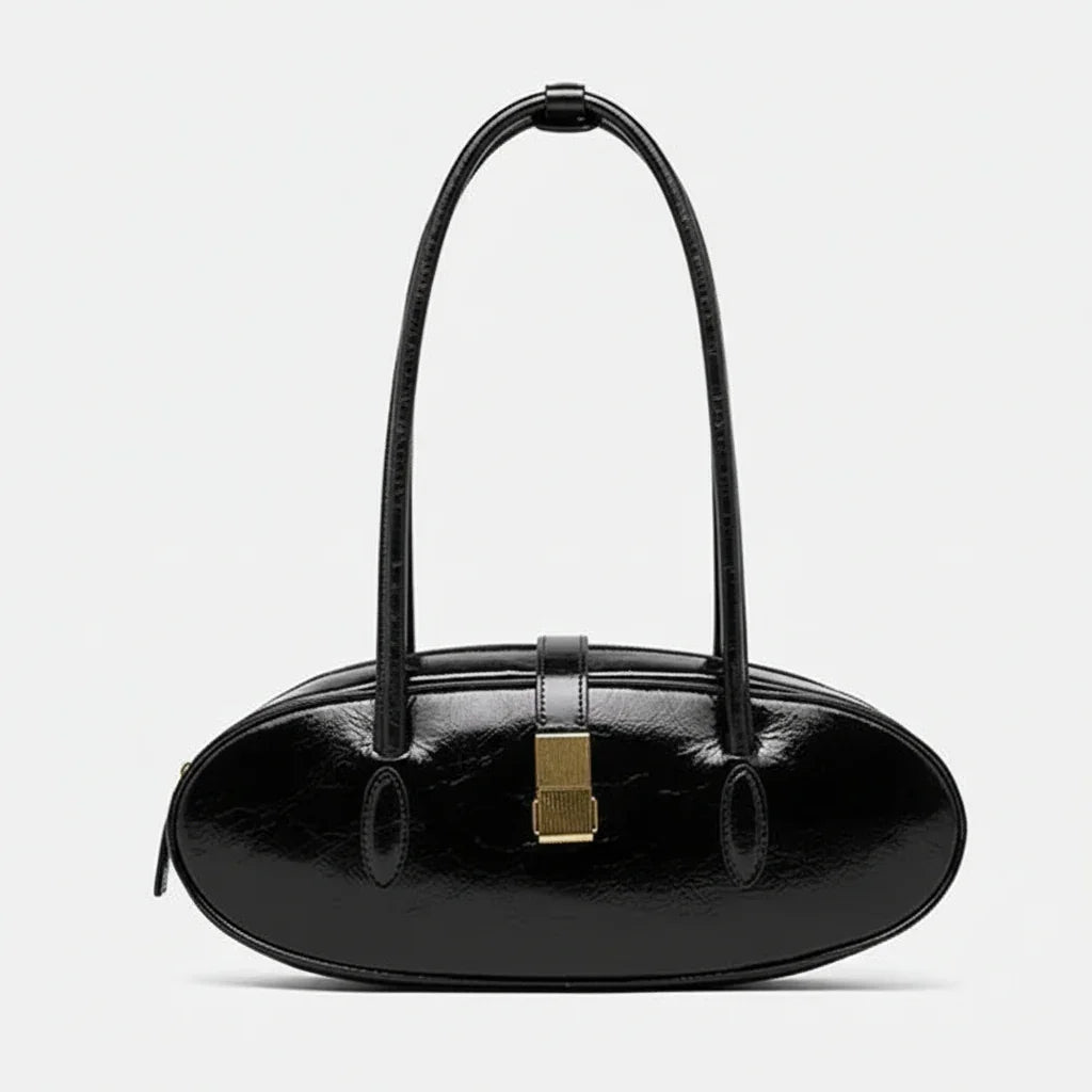 Black oval leather handbag with gold clasp and double shoulder straps on white background