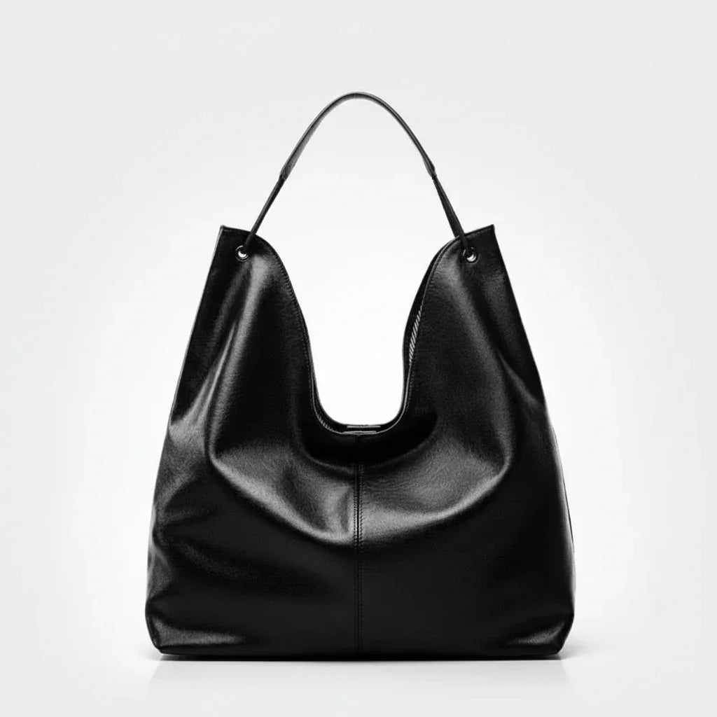 Black leather hobo bag with single handle on white background
