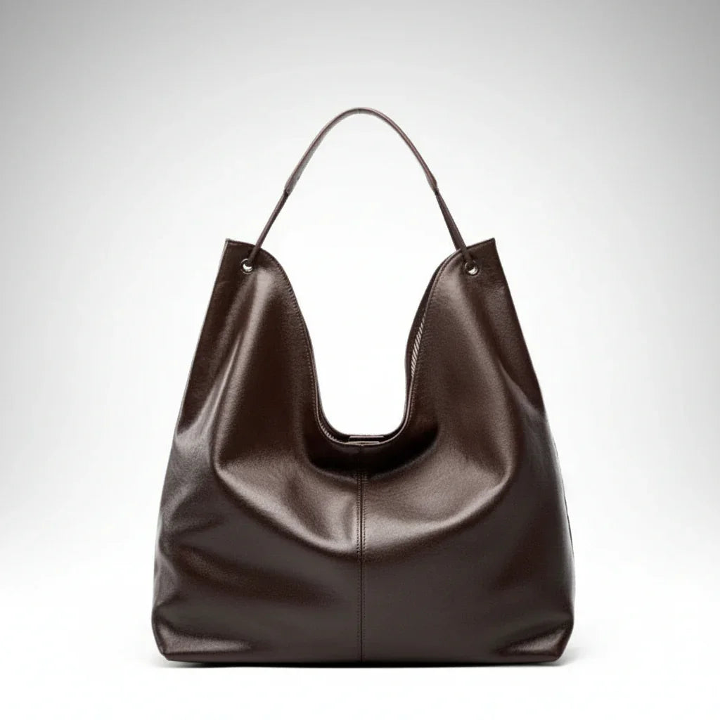 Dark brown leather hobo shoulder bag with single strap on white background