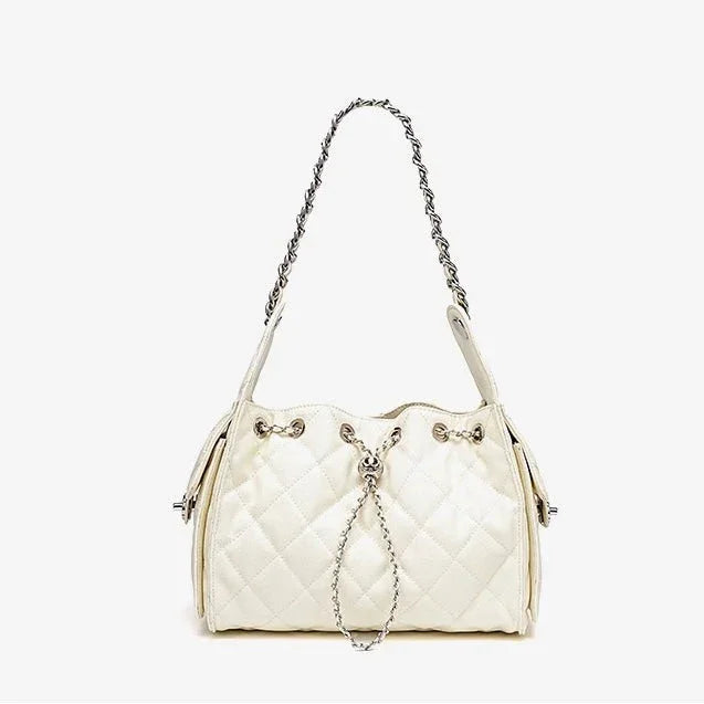Quilted white leather shoulder bag with chain strap and silver hardware on white background