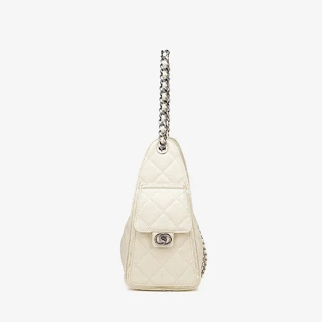 Side view of a quilted white leather handbag with silver chain strap and turn-lock closure