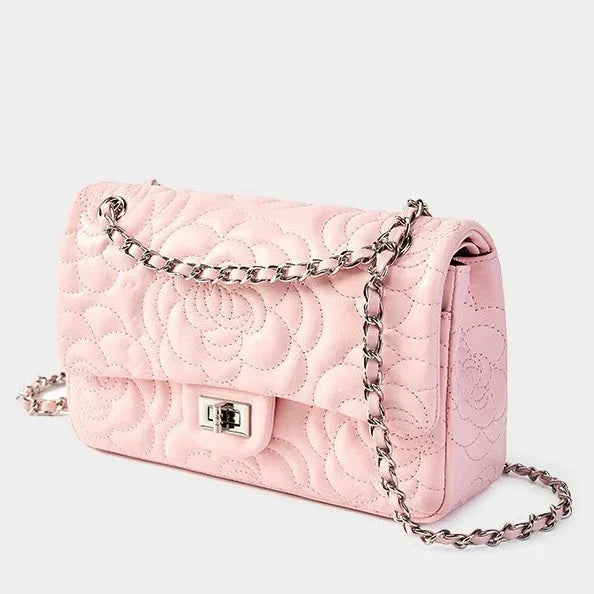 Light pink quilted leather shoulder bag with silver chain strap and floral pattern