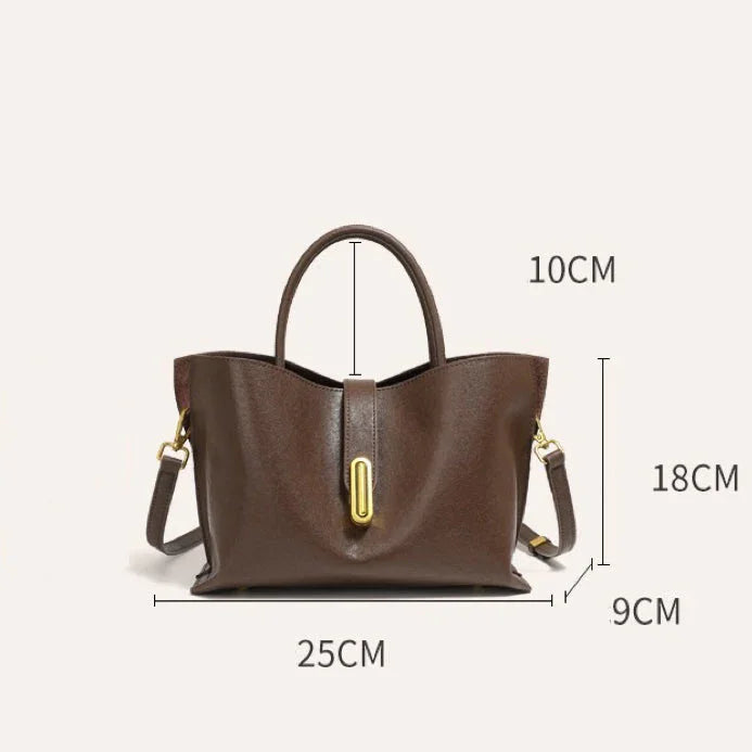 Brown leather handbag with gold hardware, top handle, dimensions 25x18x9 cm, 10 cm handle