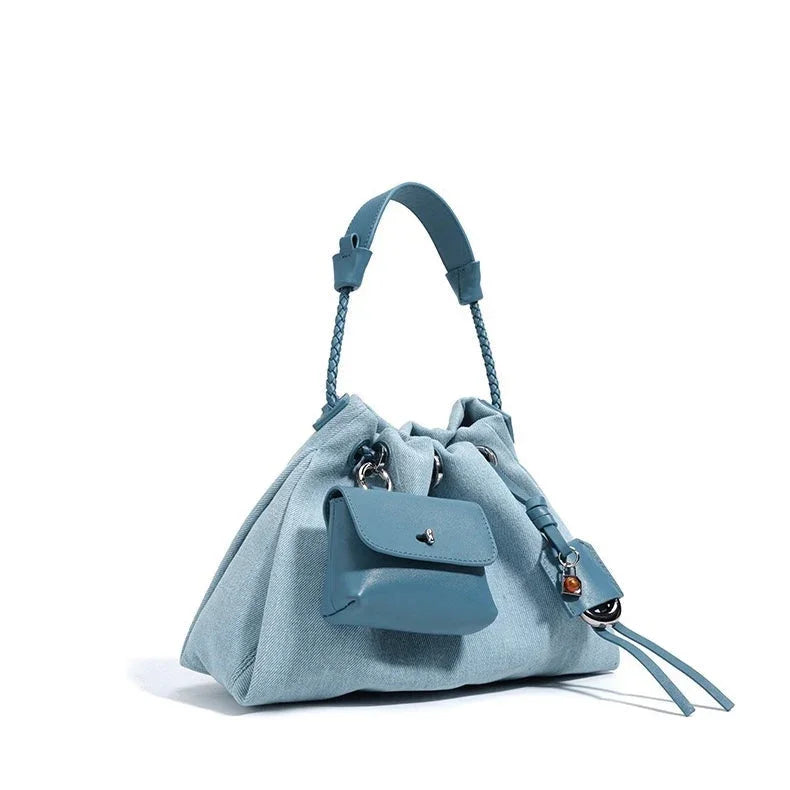 Light blue drawstring handbag with braided handle and attached mini pouch
