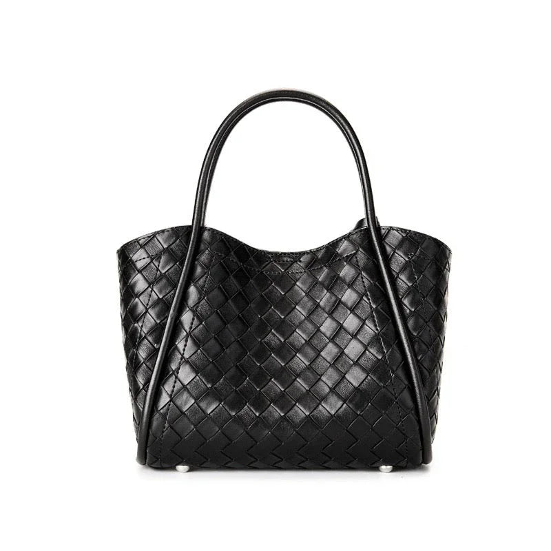 Black woven leather tote bag with double handles on white background