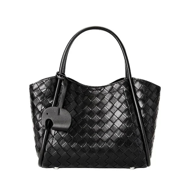 Black woven leather tote bag with dual handles and attached decorative tag
