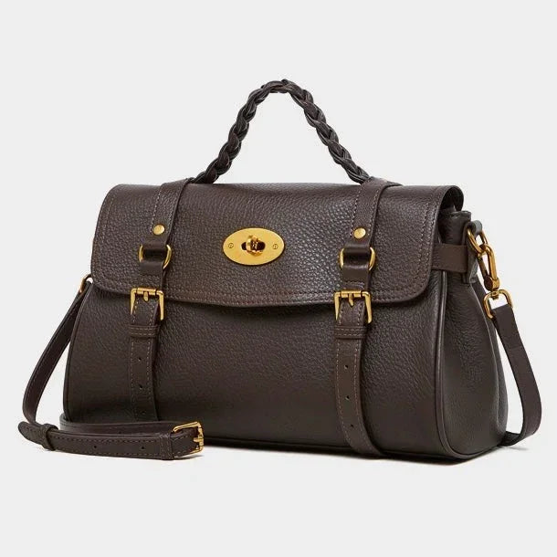 Dark brown leather satchel handbag with gold hardware and braided top handle on white background.