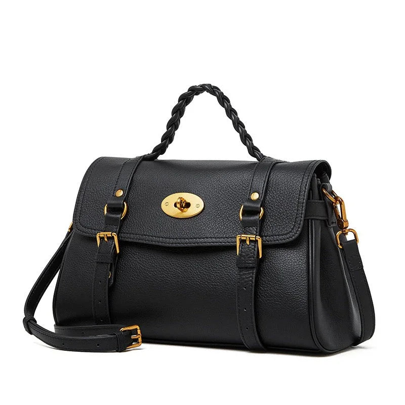 Black leather handbag with gold hardware, braided handle, and detachable shoulder strap