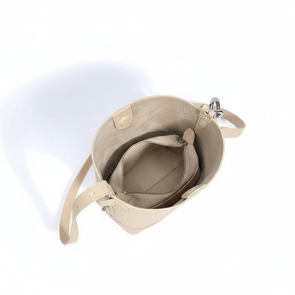 Open gray leather bucket bag with beige suede interior and zippered pocket