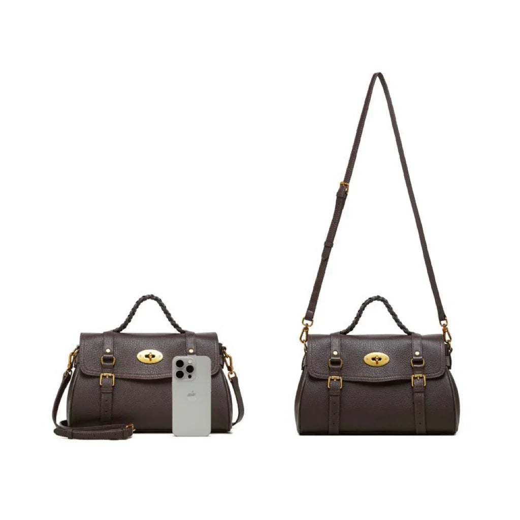 Dark brown leather satchel handbag with gold hardware and adjustable strap, shown with iPhone for size comparison
