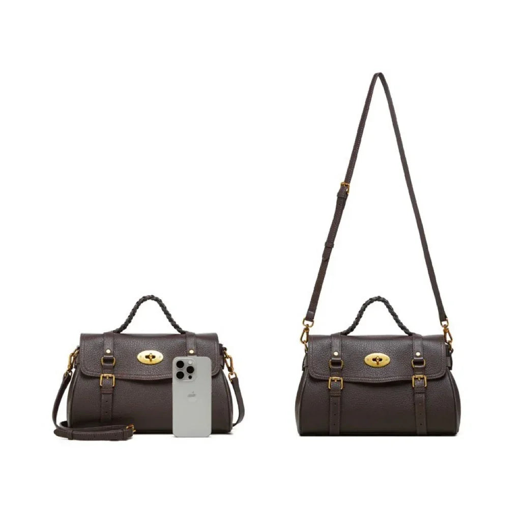 Dark brown leather satchel handbag with gold hardware and adjustable strap, shown with iPhone for size comparison
