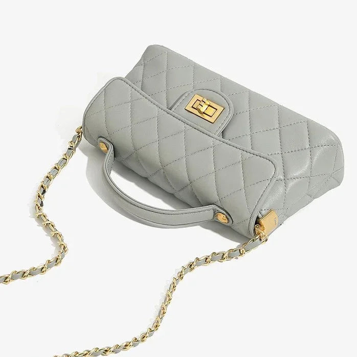 Light grey quilted leather handbag with gold chain strap and turn-lock clasp