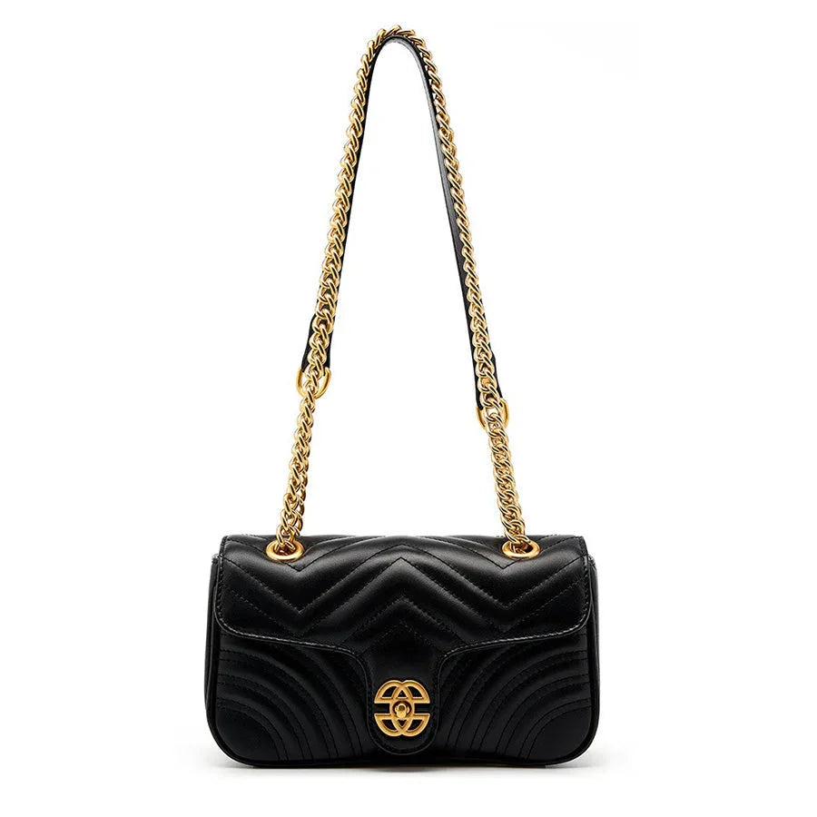 Black quilted leather shoulder bag with gold chain strap and gold clasp, luxury handbag