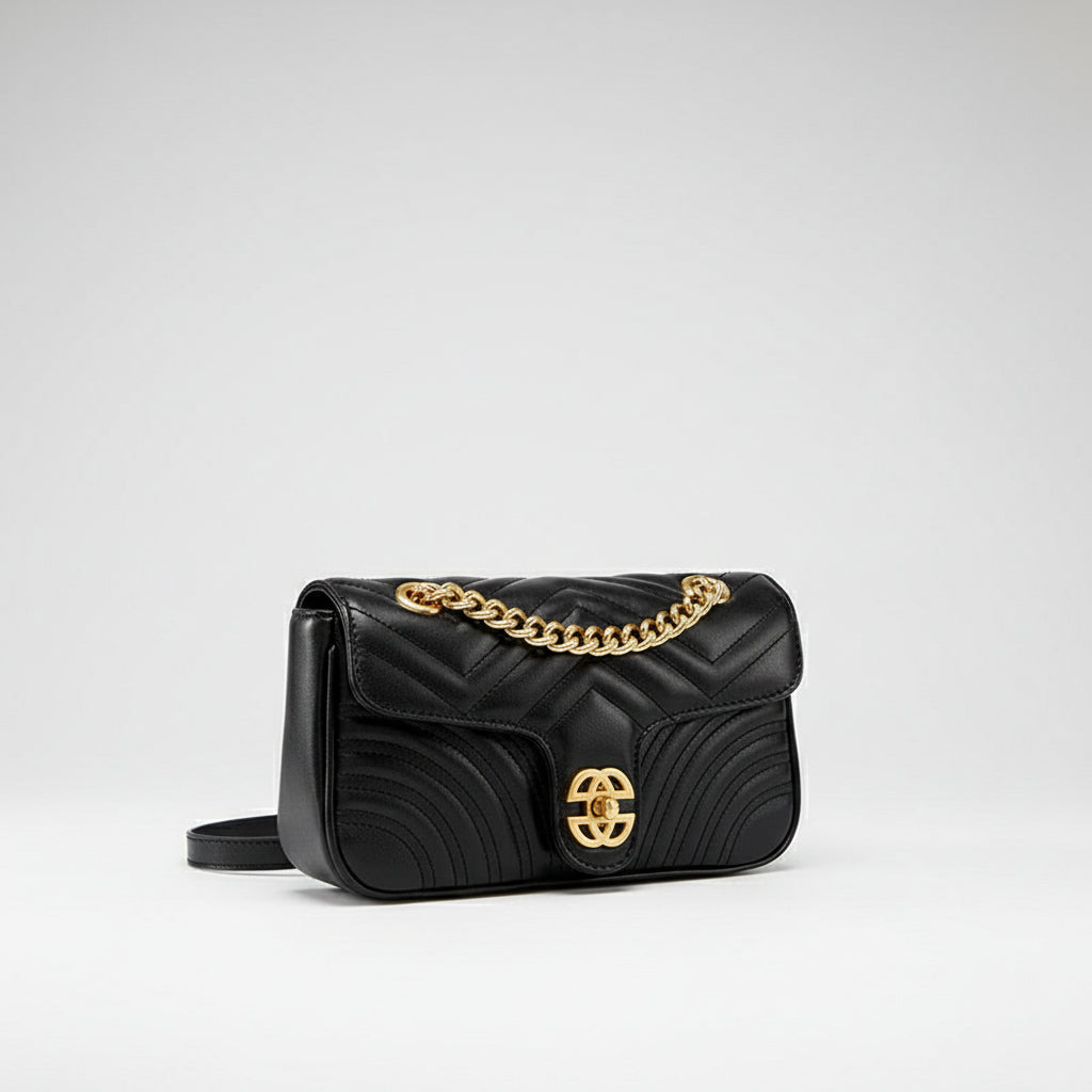 Black quilted leather shoulder bag with gold chain strap and gold clasp, luxury purse