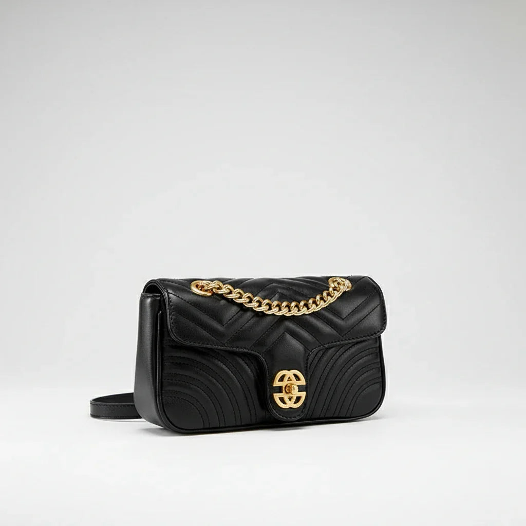 Black quilted leather shoulder bag with gold chain strap and gold clasp, luxury purse