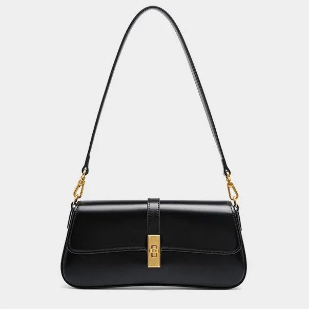 Black leather shoulder bag with gold clasp and hardware on white background