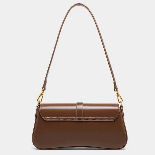 Brown leather shoulder bag with gold hardware on a white background