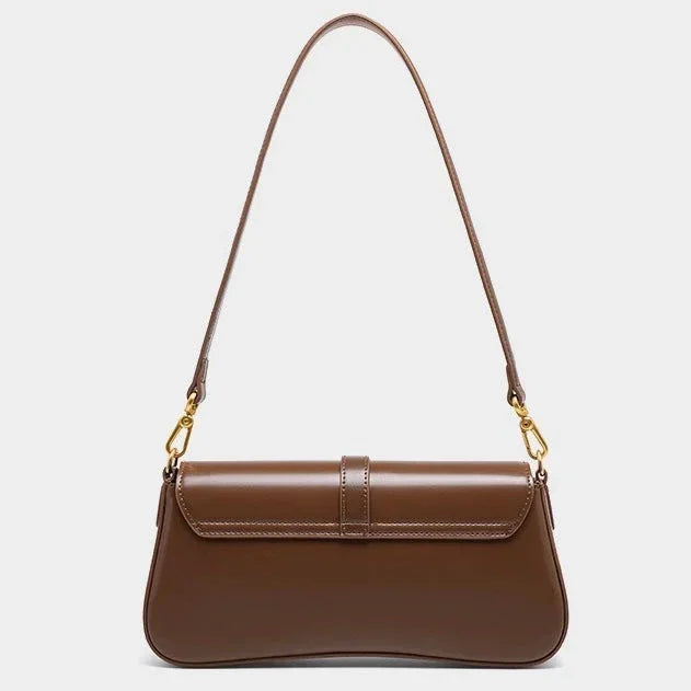 Brown leather shoulder bag with gold hardware on a white background